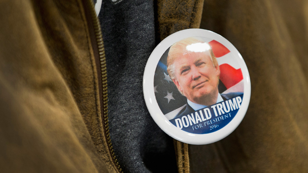 Guests wait for Republican presidential candidate Donald Trump to speak at a campaign event at Mississippi Valley Fairgrounds