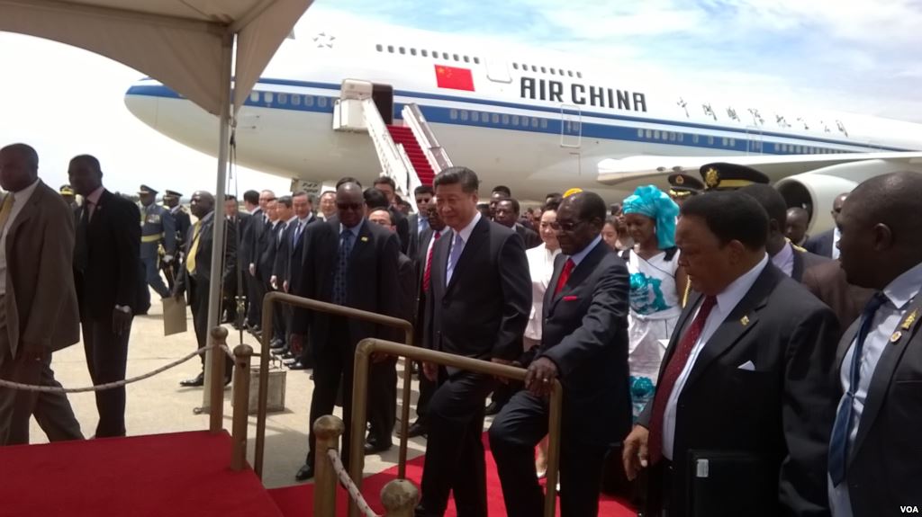 President Robert Mugabe and President Xi Jinping at Harare International Airport on Tuesday