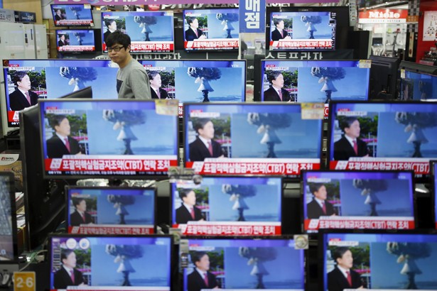 A sales assistant watches TV sets broadcasting a news report on North Korea's nuclear test in Seoul South Korea.         
                     Kim Hong Ji  Reuters