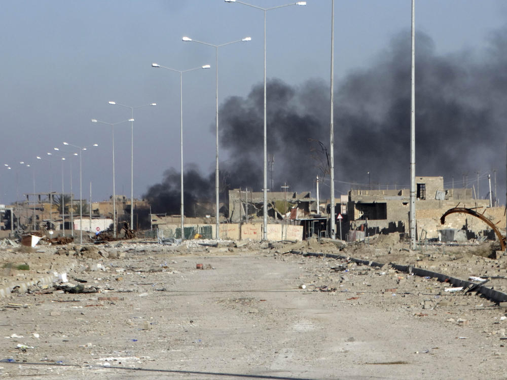 Smoke rises from ISIS positions following a U.S.-led coalition airstrike in Huz neighborhood in downtown Ramadi Iraq on Dec. 26