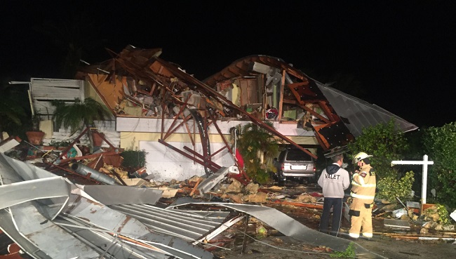 At least one woman had to be pulled from the wreckage of the home by first responders