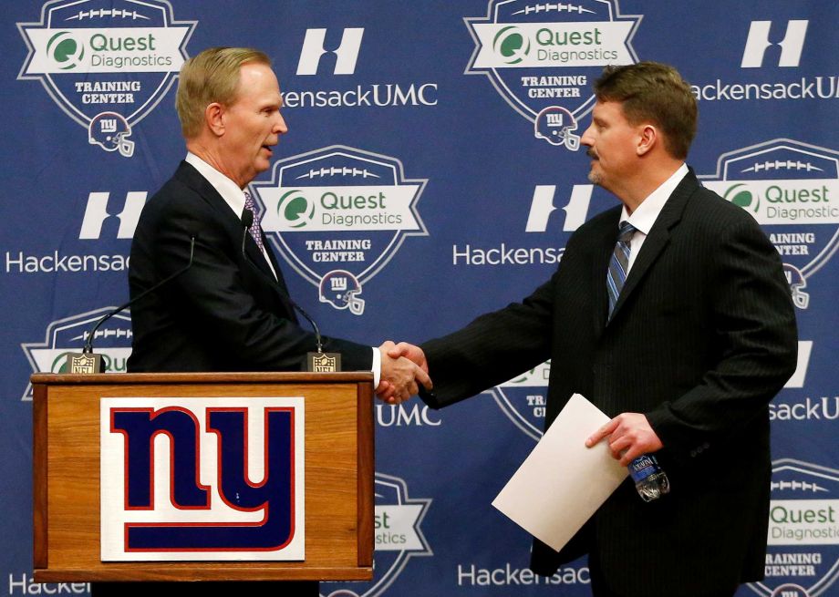 New York Giants owner John Mara left shakes hands with former New York Giants offensive coordinator Ben Mc Adoo during a news conference announcing Mc Adoo as the new head coach of the NFL team Friday Jan. 15 2016 in East Rutherford N.J