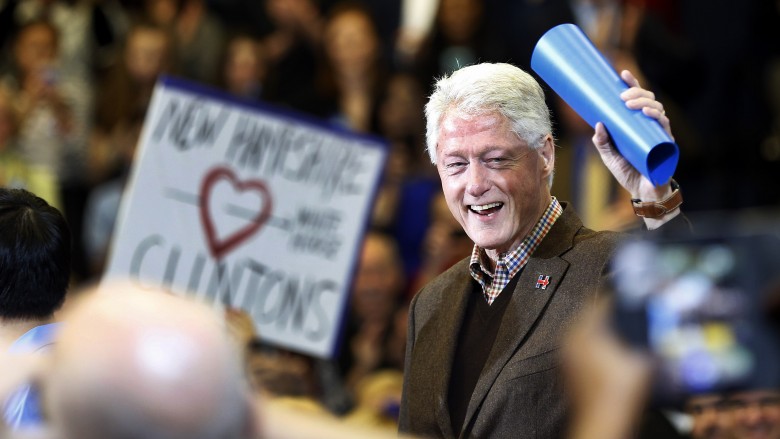 Former President Bill Clinton waves to a cheering crowd as he arrives during a campaign stop for his wife Democratic presidential candidate Hillary Clinton Monday in Nashua N.H