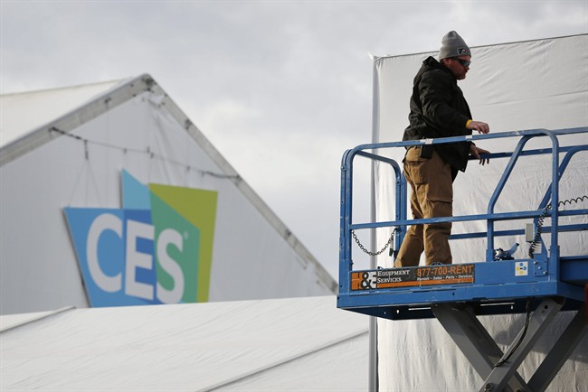 A worker helps prepare a temporary structure in preparation for the International CES gadget show Sunday Jan. 3 2016 in Las Vegas. The show officially kicks off Wednesday Jan. 6