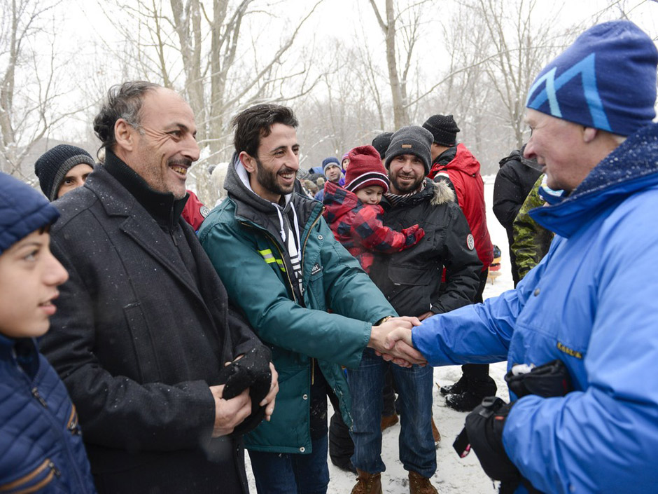 Recently arrived refugees are greeted by Governor General David Johnston during the Winter Celebration at Rideau Hall on Saturday Jan. 16 2016