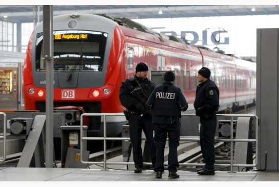 German police secure the main train station in Munich Germany Friday. The station reopened following a terror threat Thursday night