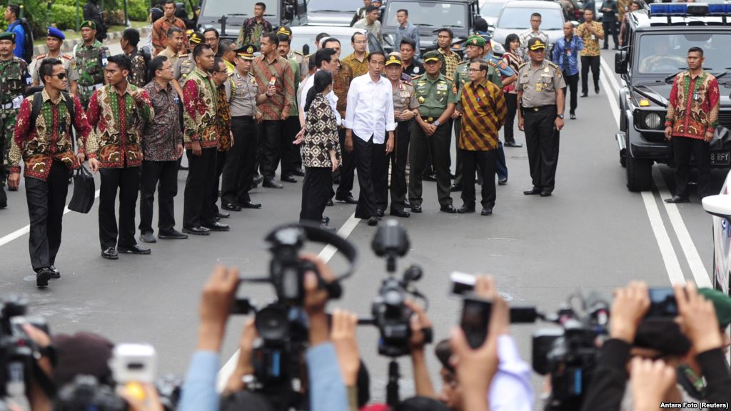 Indonesian President Joko Widodo center in white shirt visits the site of a bomb blast at Thamrin business district in Jakarta Jan. 14 2016