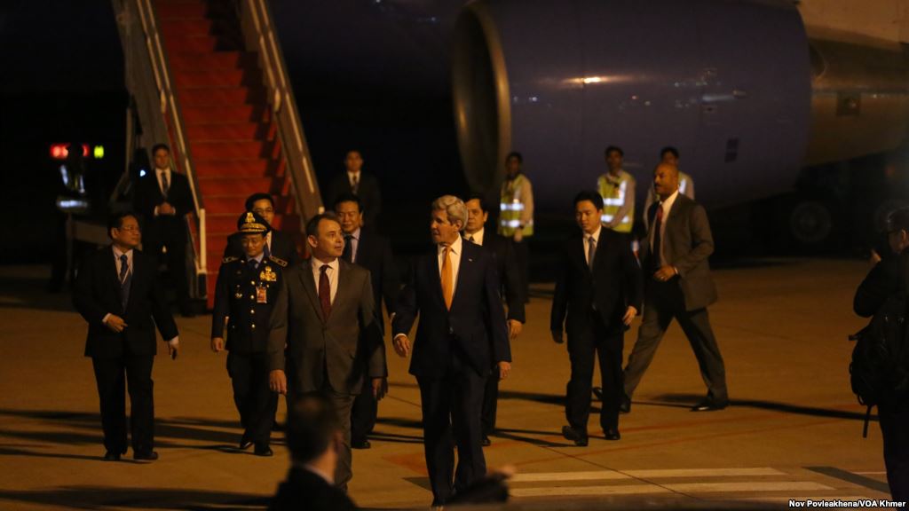 William Heidt the new U.S. Ambassador to Cambodia, walks next to US Secretary of State John Kerry as he arrives at Phnom Penh International Airport on Monday