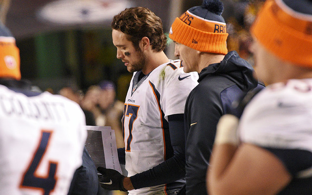 Denver Broncos quarterback Brock Osweiler left stood with Peyton Manning on the sidelines during the second half against the Pittsburgh Steelers in Pittsburgh on Dec. 20. The Steelers won 34-27