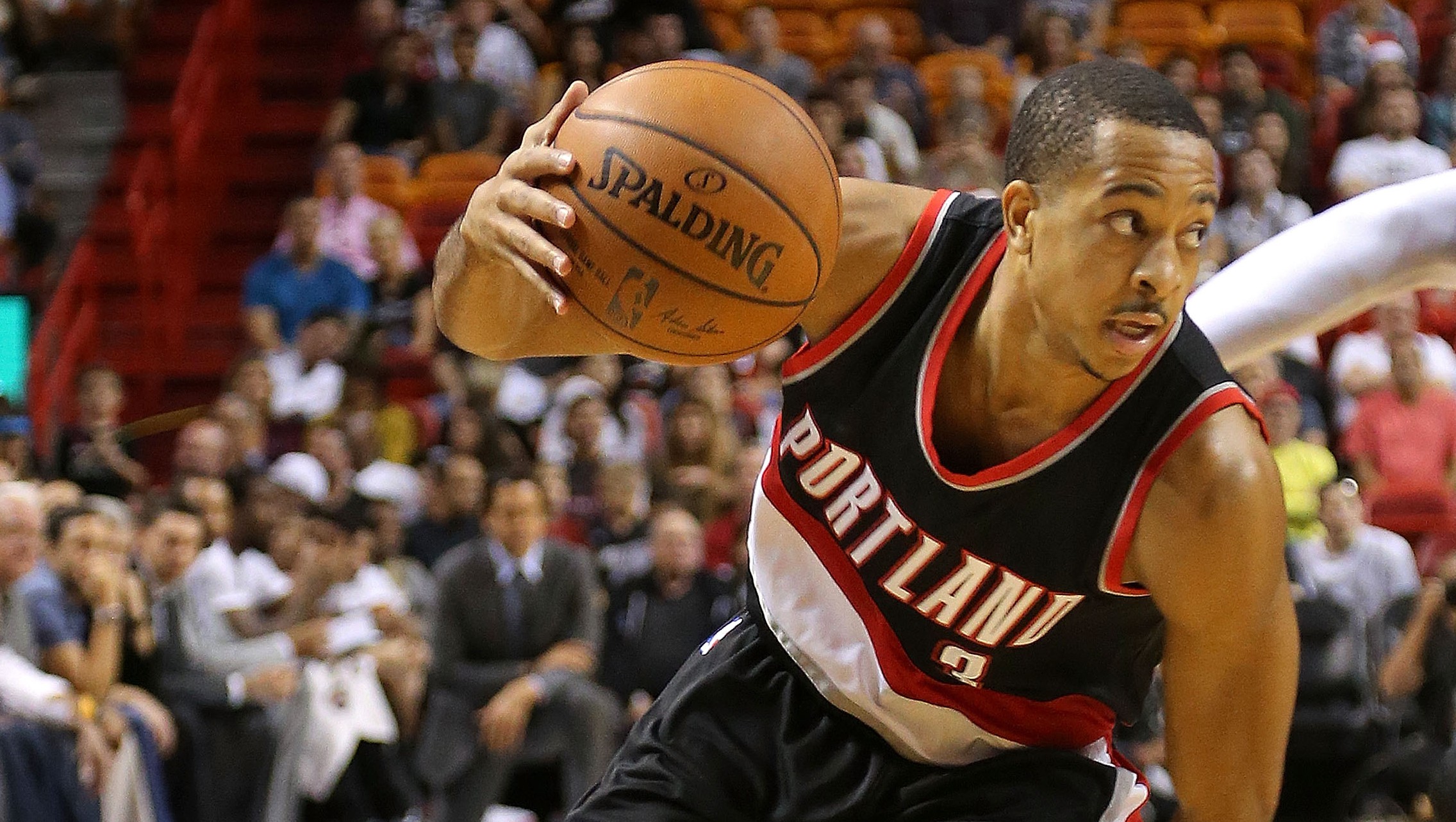 MIAMI FL- DECEMBER 20 C.J. Mc Collum #3 of the Portland Trail Blazers drives to the basket during a game against the Miami Heat at American Airlines Arena