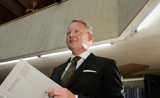 Head of the editing team Christian Hartmann posing with a copy of the new critical edition of Adolf Hitler’s “Mein Kampf” during the book presentation at the Institut fuer Zeitgeschichte in Munich Germany on Jan. 8