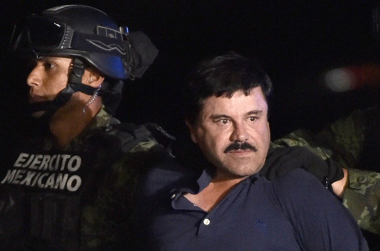 Drug kingpin Joaquin ‘El Chapo’ Guzman is escorted into a helicopter late yesterday following his recapture during an intense military operation in Los Mochis in Sinaloa State. Mexican marines recaptured the fugitive drug kingpin six months after