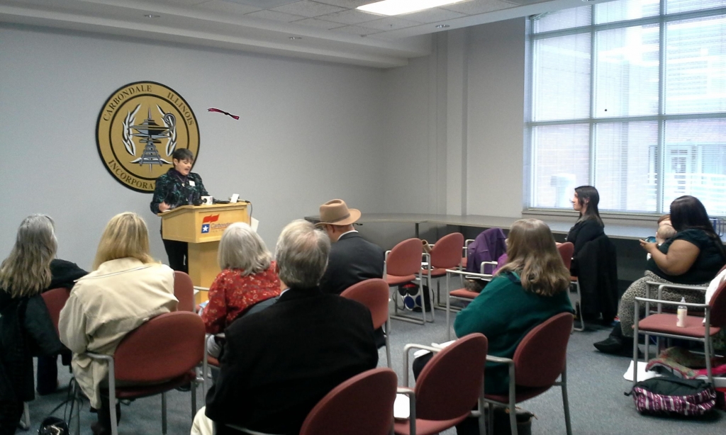 Miriam Link Mullison comments to those gathered for the'State of our State news conference at Carbondale's Civic Center. 
 Brad Palmer WSIU Radio