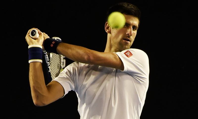 Novak Djokovic of Serbia practices on Rod Laver Arena in preparation for the Australian Open in Melbourne