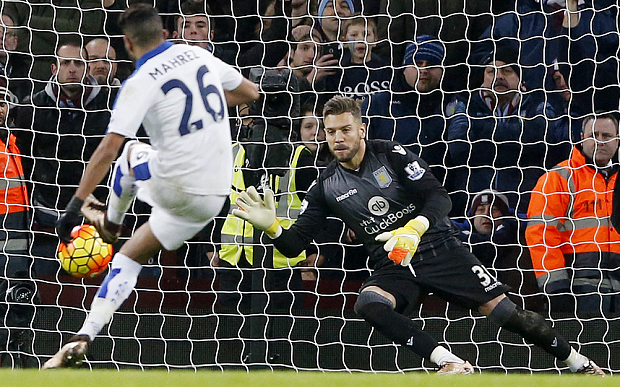 On the spot Mark Bunn guesses right to save Riyad Mahrez's penalty kick before Villa's late rally rescued a point against Leicester