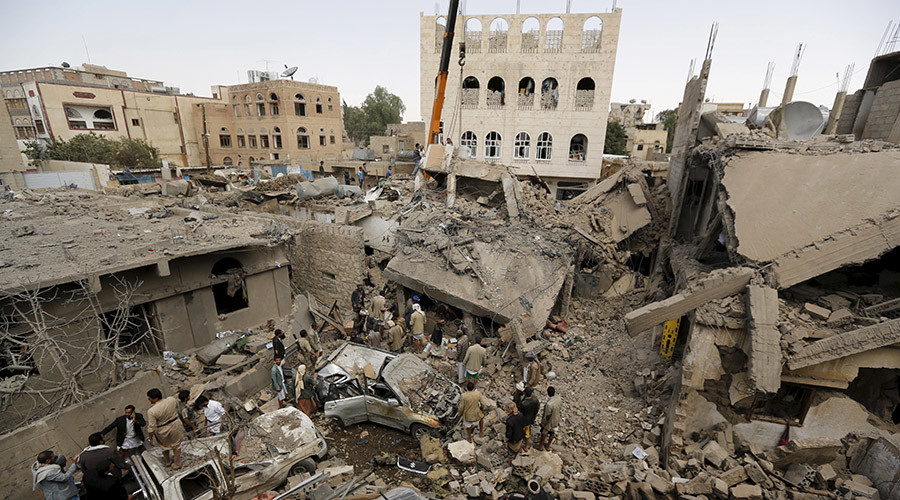 People gather at the site of a Saudi-led air strike in Yemen's capital Sanaa