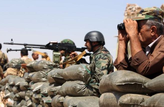 Peshmerga soldiers are seen near Mosul where Turkish troops are also deployed to run a training program in Bashiqa camp