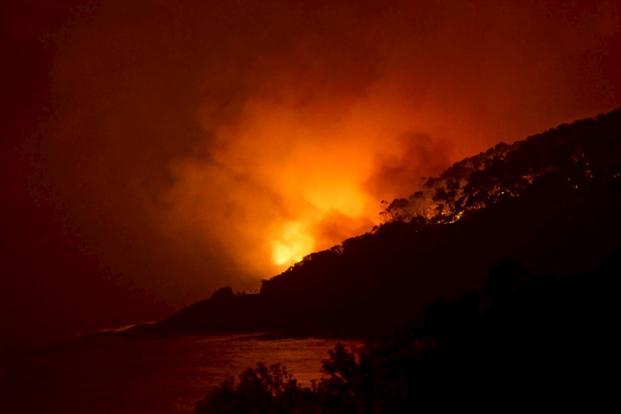 A bushfire burns at Wye River near Lorne south of Melbourne on 25 December