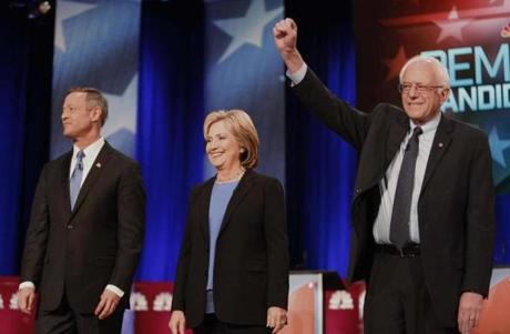 Senator Bernie Sanders stood with opponents former Maryland Governor Martin O’Malley and former Secretary of State Hillary Clinton before the start of Sunday’s Democratic presidential debate