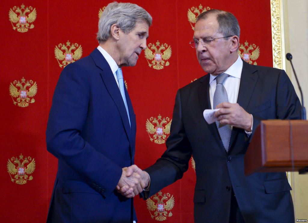 FILE- U.S. Secretary of State John Kerry and Russia's Foreign Minister Sergei Lavrov shake hands during a joint news conference at the Kremlin in Moscow Dec. 15 2015