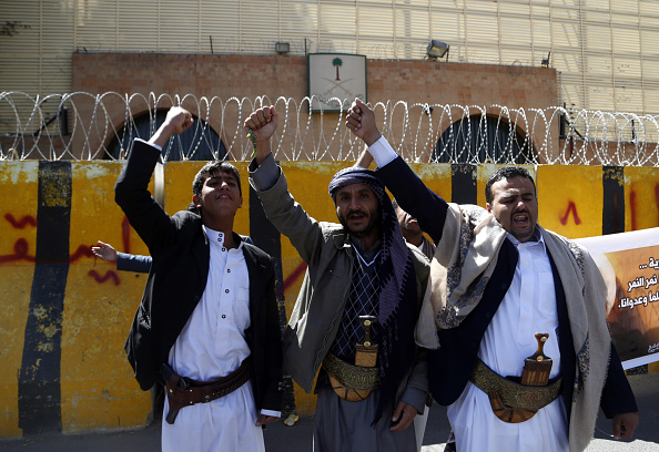 SANA'A YEMEN- OCTOBER 18 Supporters of the Ansarullah Movement chant slogans to protest the death sentence given to Saudi Shia cleric Sheikh Nimr Baqir al Nimr outside the embassy of Saudi Arabia in Sana'a Yemen