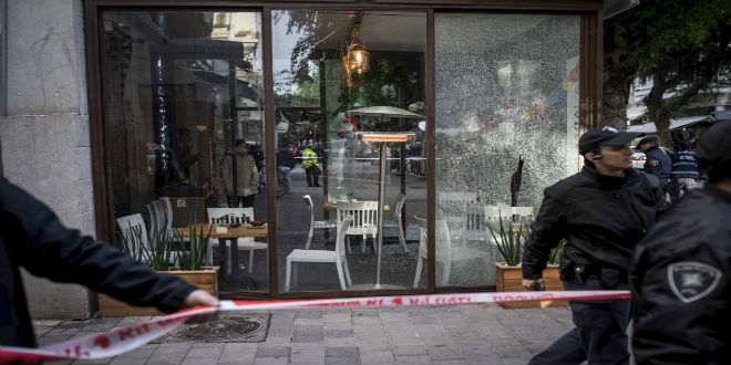 Israeli security forces at the scene of a shooting attack at a pub in central Tel Aviv on Friday