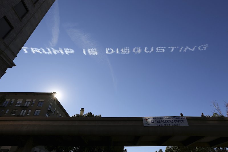 Skywriting over the 127th Rose Parade makes a reference to US Republican presidential candidate Donald Trump in Pasadena California yesterday. The planes circled for almost an hour after the parade writing messages such as'Trump is delusional. – R