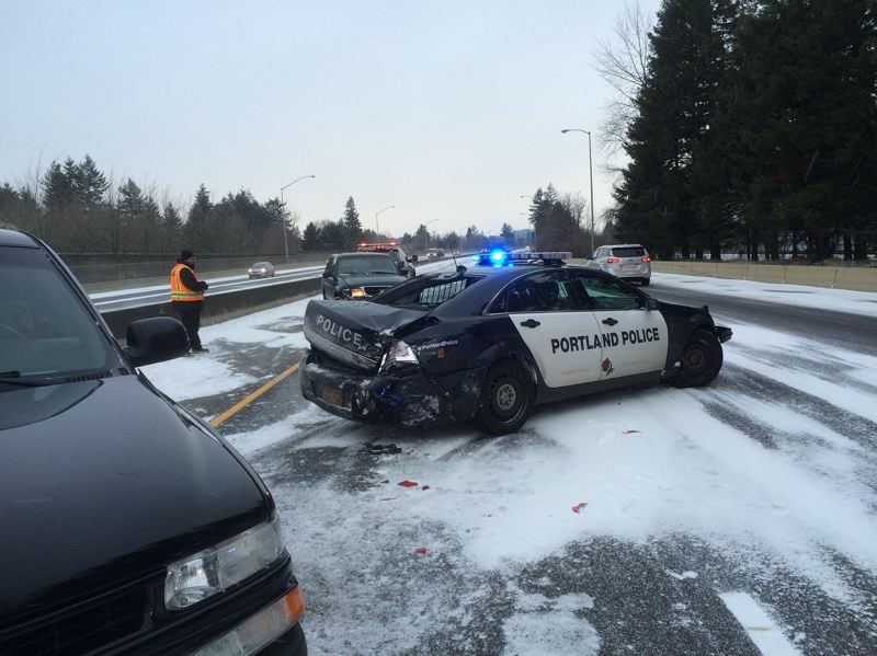 PORTLAND POLICE BUREAU- A North Precinct officer suffered minor injuries in this Sunday morning crash on I-84