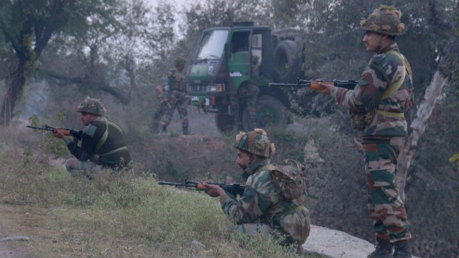 Indian soldiers stand outside an Indian air force base in Pathankot, north of 