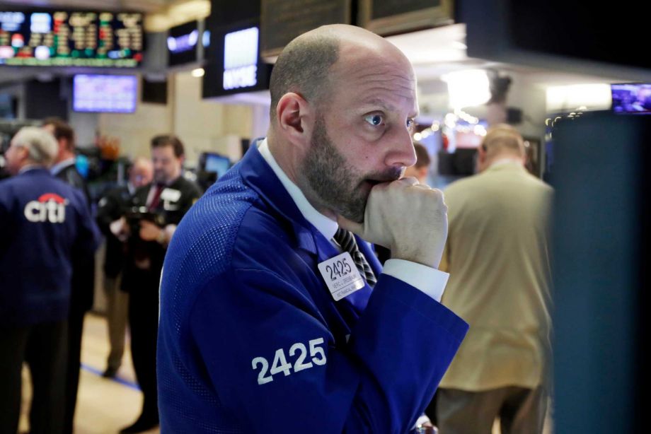 Specialist Meric Greenbaum works on the floor of the New York Stock Exchange on Thursday. Worries about China’s economy and dropping oil prices helped fuel the worst one-day drop on Wall Street since late September