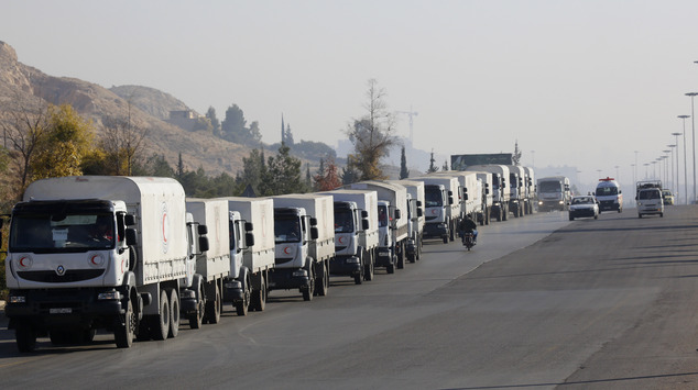 A convoy of trucks loaded with humanitarian supplies are seen heading to the besieged town of Madaya some 24 kilometers in southwest Damascus Syria on Thu