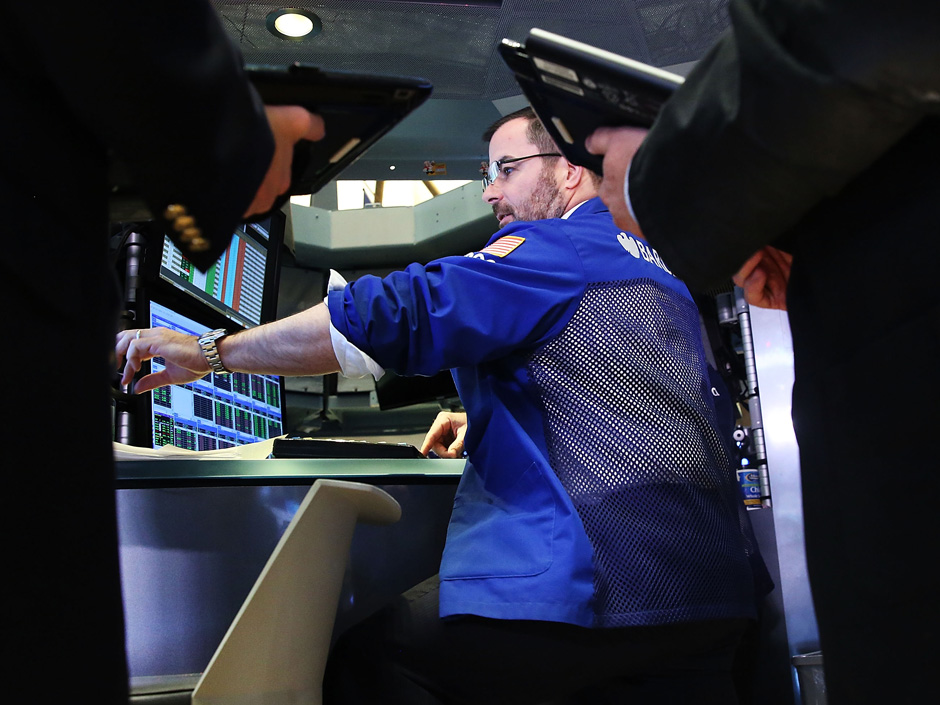 Traders work on the floor of the New York Stock Exchange