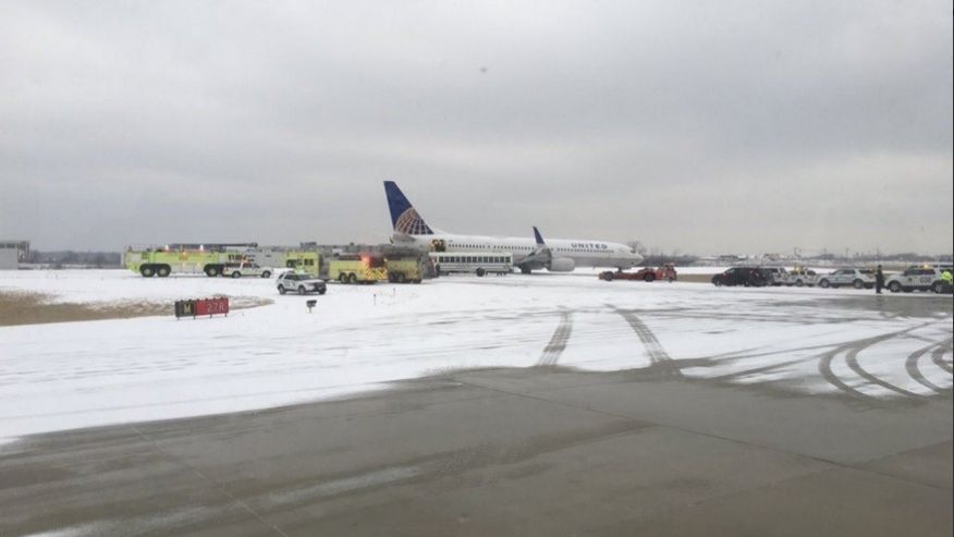 Plane slides off runway at O'Hare Airport