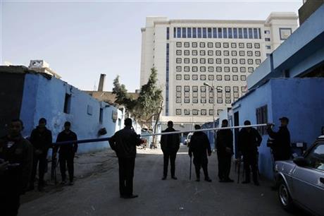 Egyptian security forces stand guard outside Zeinhom morgue where the body of Giulio Regeni a 28-year-old graduate student is held Thursday Feb. 4 2016. The body of the missing Italian student was found with signs of torture including multiple stab