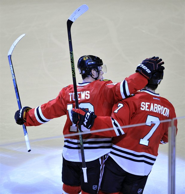 Chicago Blackhawks Jonathan Toews, celebrates with teammate Brent Seabrook, after Seabrook scored a goal during the second period of a hockey game against the Anaheim Ducks Saturday Feb. 13 2016 in Chicago