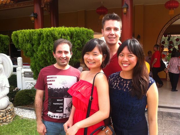 Pik Fang Xiao Qian and Gabriel and Puya enjoy the Chinese New Year Eve celebrations held at the Chung Tian Temple in Underwood on Sunday