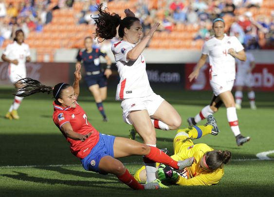 McLeod right grabs the ball as Allysha Chapman avoids her as Costa Rica's Melissa Herrera slides during the first half of a CONCACAF Olympic women's soccer qualifying championship semifinal Friday Feb. 19 2016