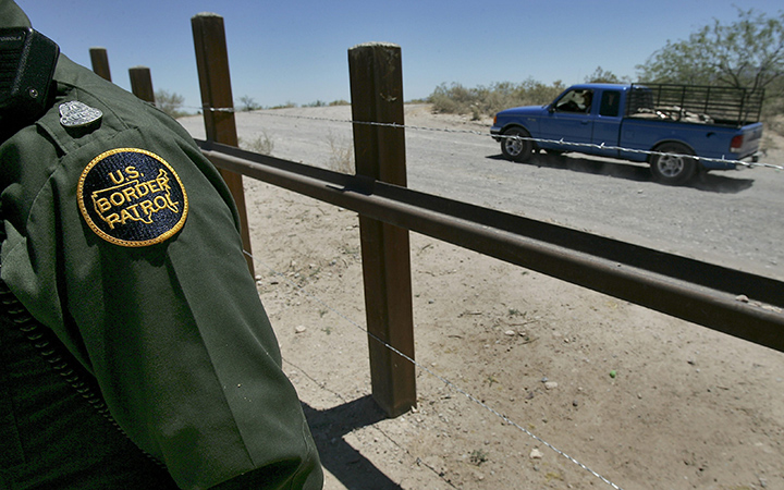 A truck passes on the Mexican side of the border with Arizona