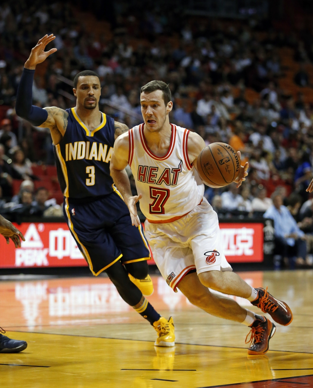 Miami Heat's Goran Dragic dribbles to the basket against Indiana Pacers George Hill during the first half of an NBA basketball game Monday Feb. 22 2016 in Miami