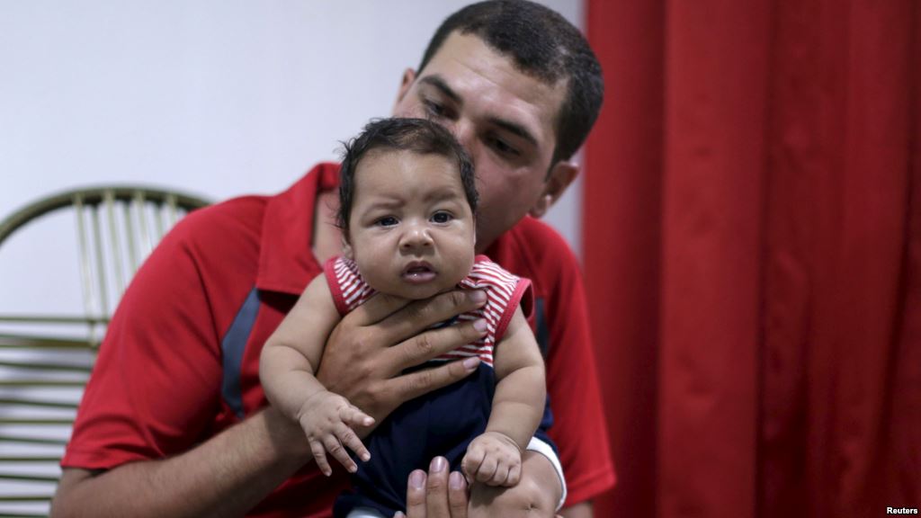 FILE- Glecion Fernando holds his 2-month-old son Guilherme Soares Amorim who was born with microcephaly in Ipojuca Brazil Feb. 1 2016