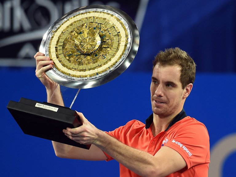 France's Richard Gasquet poses with his trophy