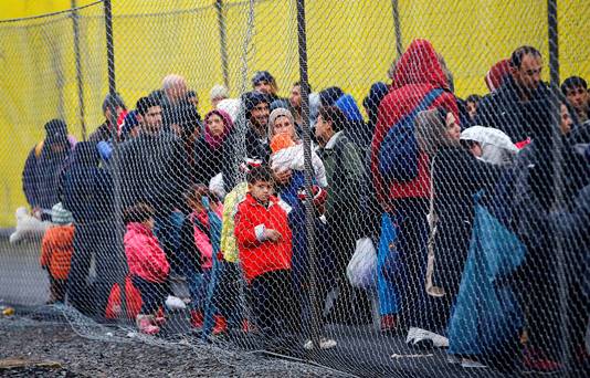 Migrants wait to cross the border from Slovenia into Spielfeld in Austria. Reuters  Leonhard Foeger