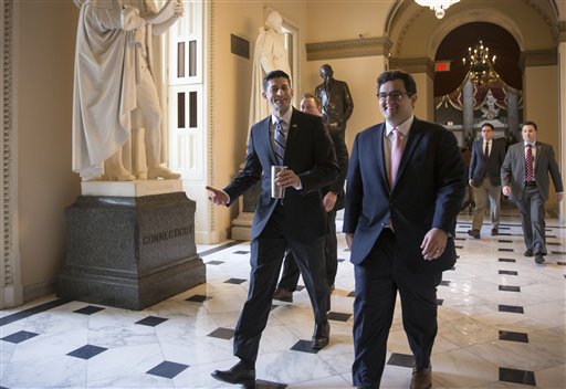 House Speaker Paul Ryan of Wis. center walks to the House chamber on Capitol Hill in Washington Friday Feb. 12 2016 as Republicans and Democrats joined together to overwhelmingly approve legislation that hits North Korea with more stringent sanction