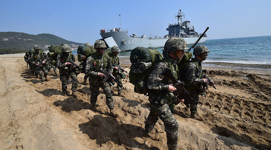 South Korean Marines march on a beach during a joint landing operation by US and South Korean Marines in the southeastern port of Pohang