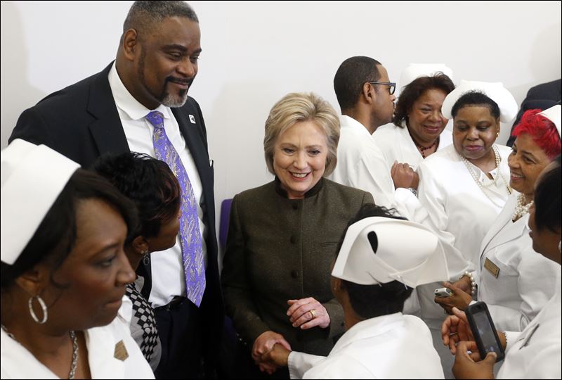 Democratic presidential candidate Hillary Clinton meets members of the House Of Prayer Missionary Baptist Church today in Flint Mich