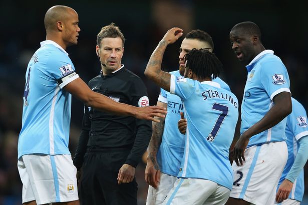 Raheem Sterling protests with referee Mark Clattenburg