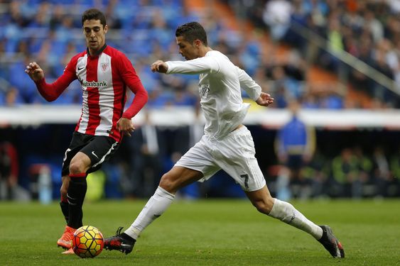 Ronaldo right duels for the ball with Athletic Bilbao's Sabin Merino during a Spanish La Liga soccer match between Real Madrid and Athletic Bilbao at the Santiago Bernabeu stadium in Madrid Spain Saturday Feb. 13 2016