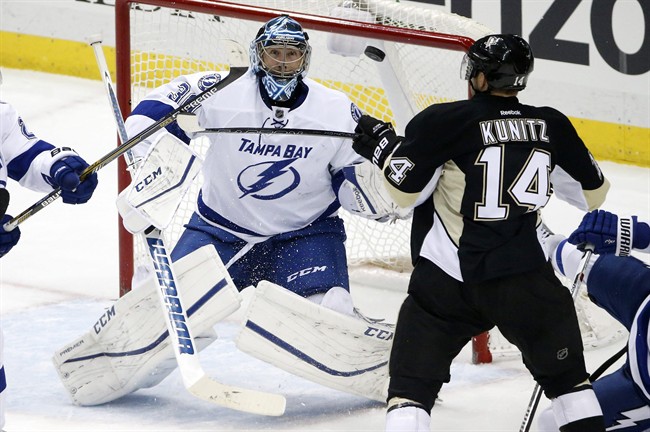 Pittsburgh Penguins Chris Kunitz can't get his stick on a rebound in front of Tampa Bay Lightning goalie Ben Bishop during the first period of an NHL hockey game in Pittsburgh Saturday Feb. 20 2016