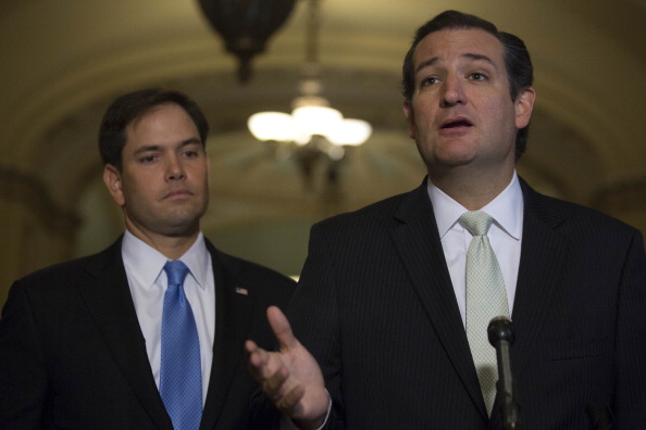 Caption:Senator Ted Cruz a Republican from Texas right speaks during a news conference with Senator Marco Rubio a Republican from Florida following a vote in Washington D.C. U.S. on Friday Sept. 27 2013. The U.S. Senate voted to finance the gove