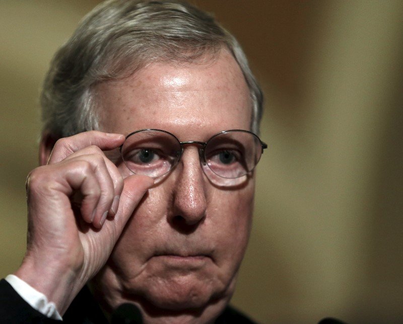 Senate Majority Leader Mitch Mc Connell adjusts his glasses while taking questions on the upcoming budget battle on Capitol Hill in Washingt